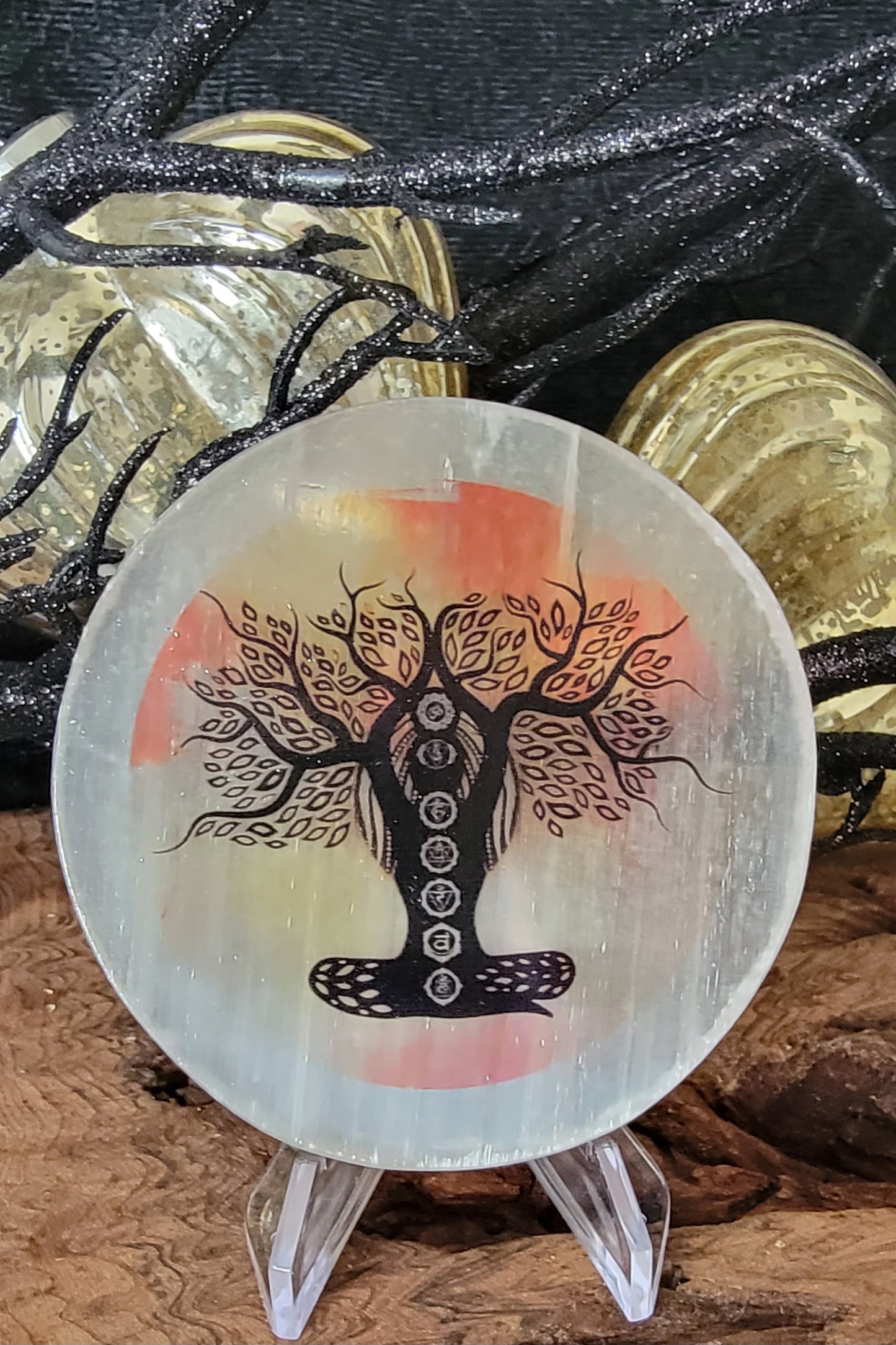 Selenite Plate with chakra tree of life shaped as a person, an orange and yellow warer color background
