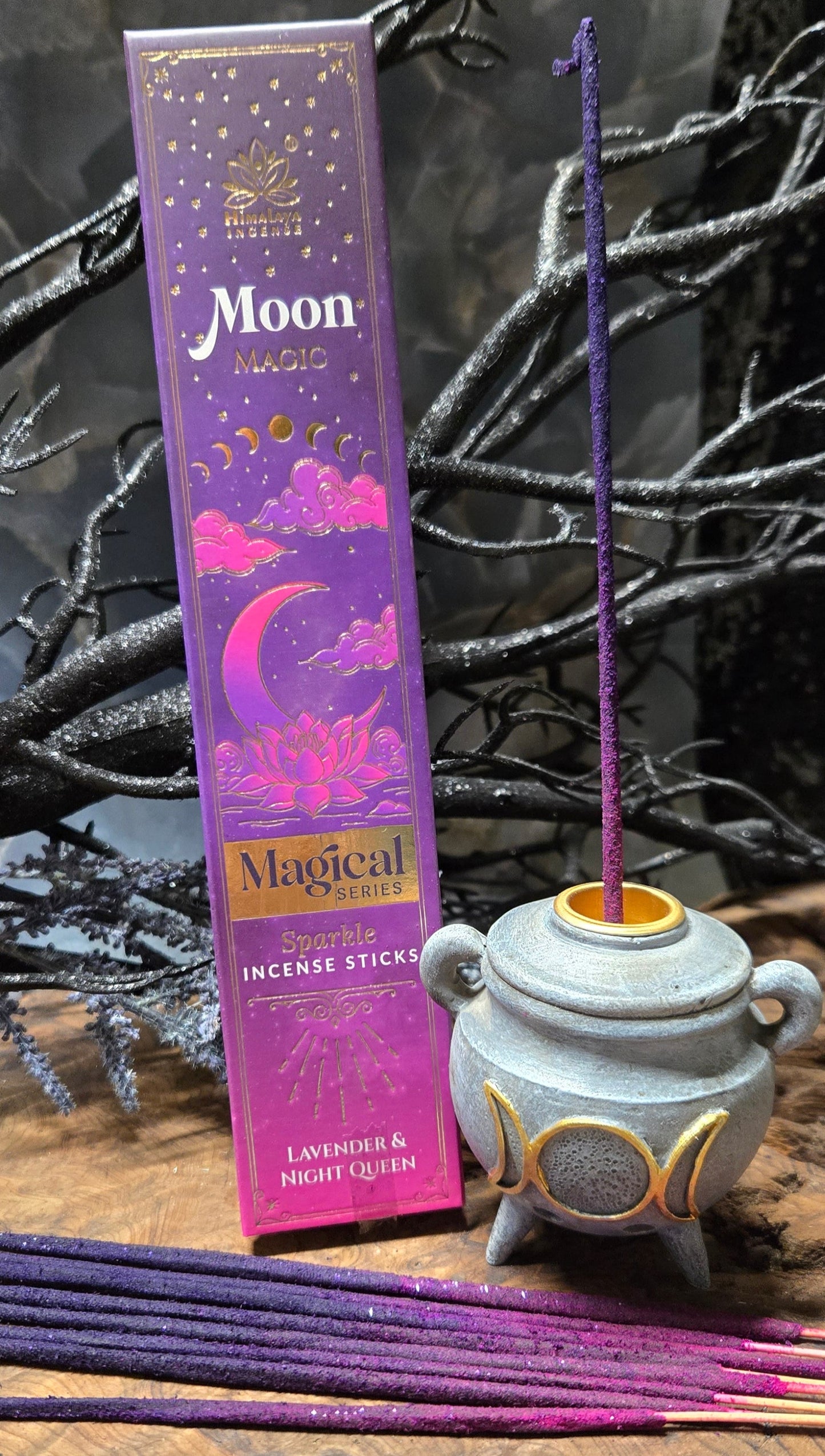 Purple incense stick box with 'Moon' branding on a dark background