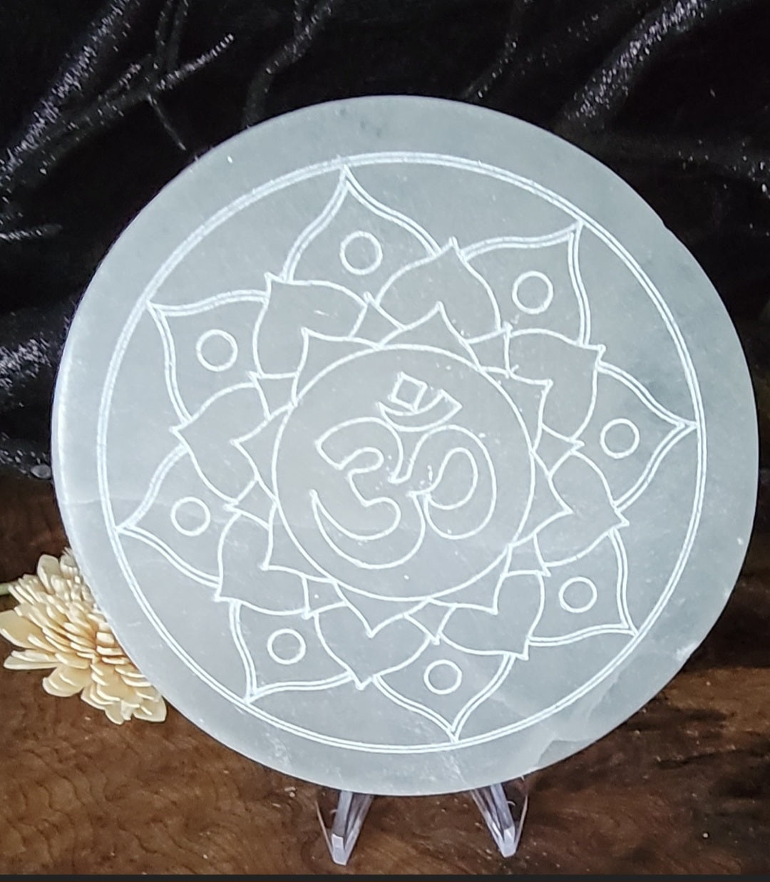 Round Selenite plate with Lotus flower, and om symbol. Engraved