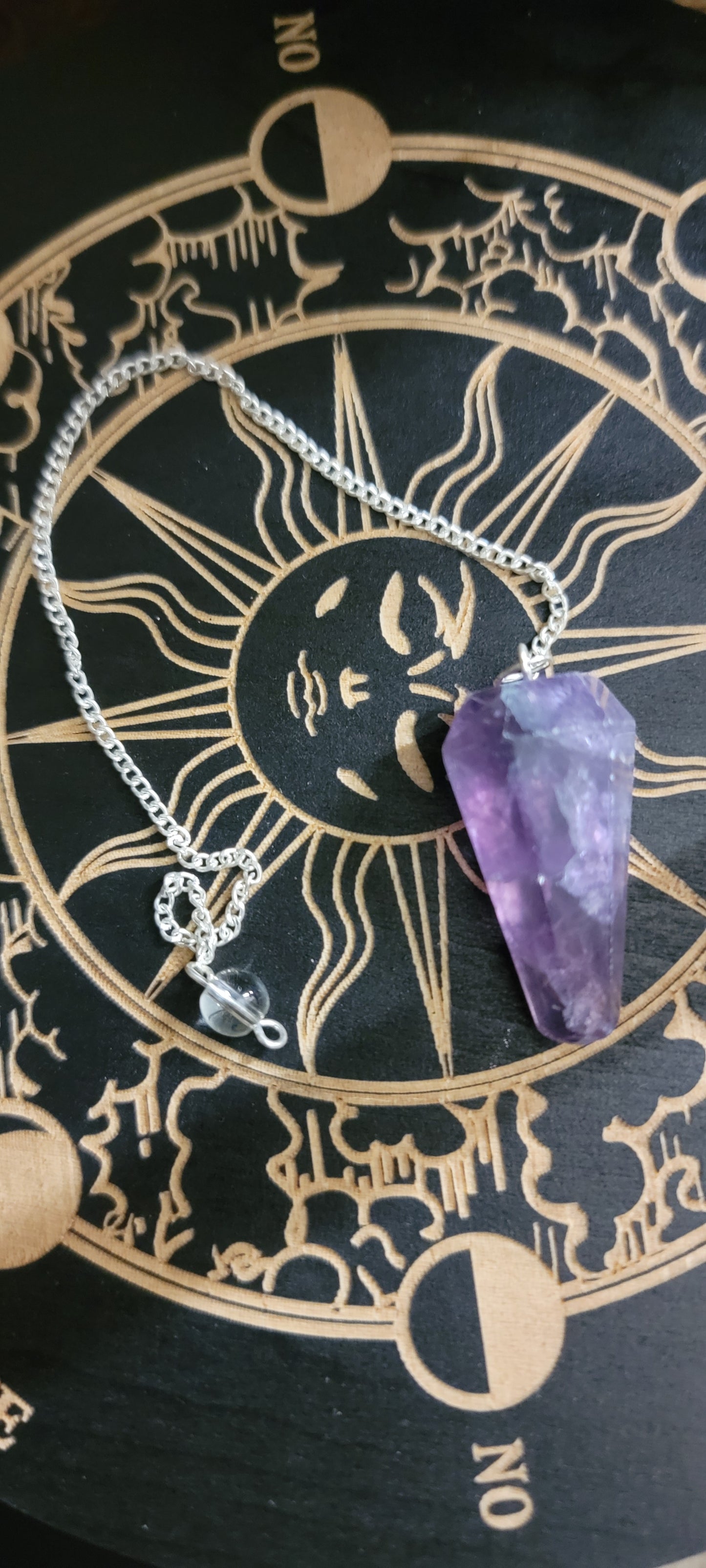 Smooth pointed fluorite crystal pendulum on a chrome chain