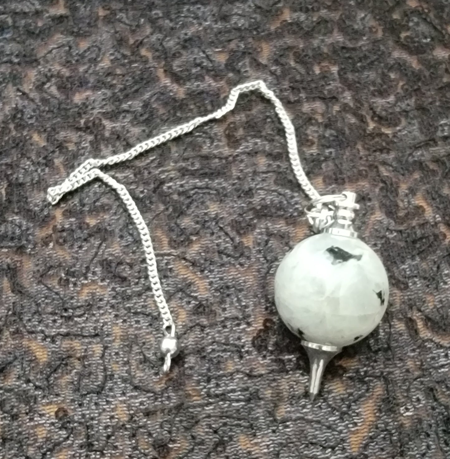 Round Rainbow moonstone sephorotone, pendulum, hanging on a chrome chain