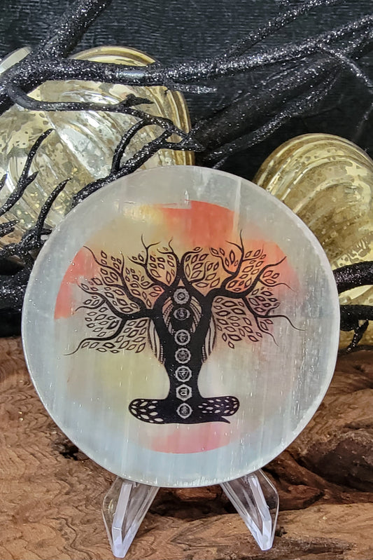 Selenite Plate with chakra tree of life shaped as a person, an orange and yellow warer color background