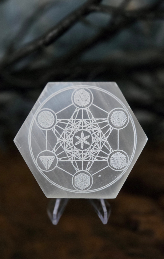 Hexagonal crystal with geometric design on a dark background