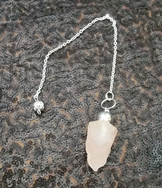 Natural rose quartz, pendulum, hanging on a chrome chain