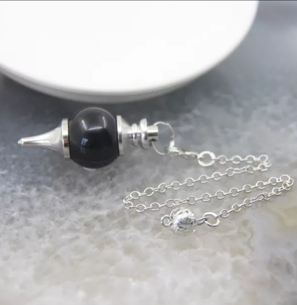 Round obsidian, sephorotome, pendulum, hanging on a chrome chain